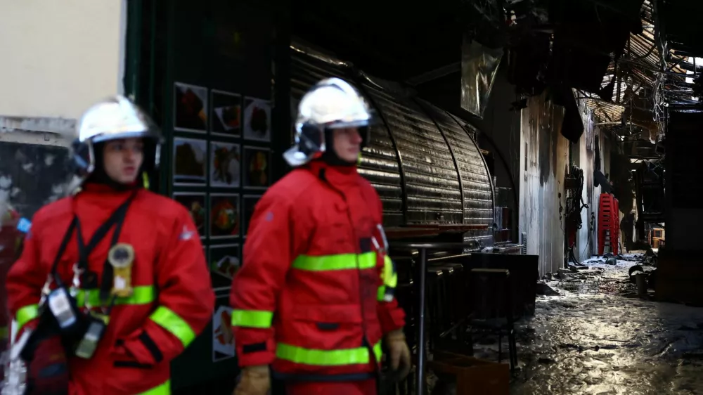 French firefighters conduct safety operations at the Marche des Enfants Rouges market in central Paris after it was destroyed by a fire, in Paris, France, October 12, 2026. REUTERS/Sarah Meyssonnier
