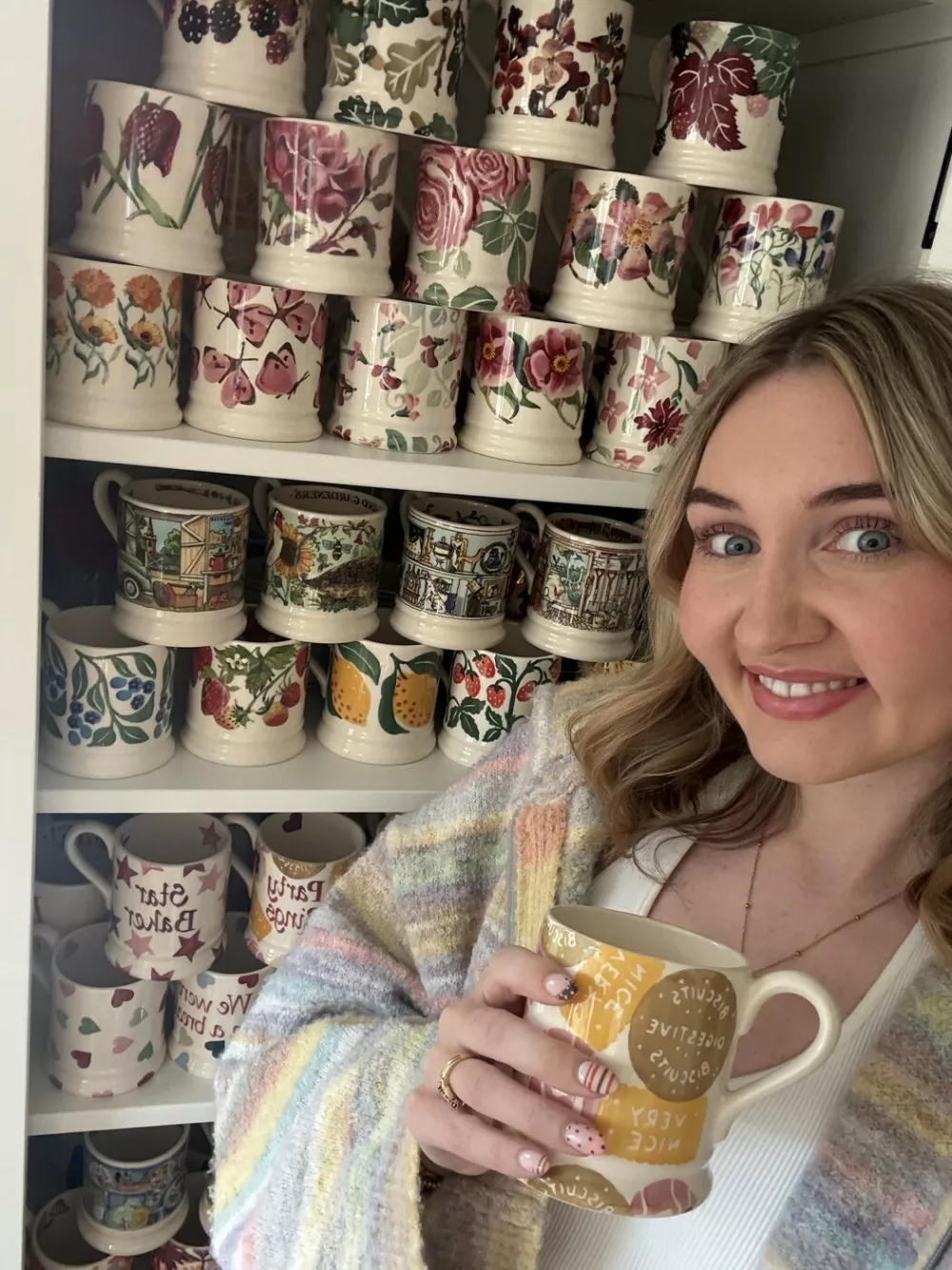Story from Jam Press (Mug Collection)Pictured: Amy showing her mug collection.'I have spent Ł2,500 on MUGS in search of the perfect cuppa with over 250 options in a dedicated cupboard &ndash; but I always pull out THIS one for builders'A woman obsessed with finding the perfect cuppa has spent over Ł2,500 on mugs &ndash; for which she has a dedicated cupboard that leaves people shocked.Amy Sinfield has gone viral after sharing the extent of her passion, which has seen her purchase 100 new mugs in the past year &ndash; that's more than eight every month.In total, the 26-year-old has 256 mugs worth thousands, including a special Emma Bridgewater collection that retails at upwards of Ł20 a pop and a Sports Direct mug specifically for "workmen".Viewers online were left stunned when earlier this month, Amy revealed where she keeps her many mugs, in a clip that has over 800,000 views."A lot of my wage goes towards growing the collection," Amy, a project officer from Bedford, told creatorzine.com."Buying a new mug feels almost like a therapy session to me &ndash; a cuppa always tastes better in a new mug."I actually had to pause buying mugs for a while at my previous house because I completely ran out of cupboard space &ndash; I was at about 100 by that point."[Now], my dedicated mug cabinet is perfect because it's deep enough to stack them all the way back."I also use two kitchen cupboards above my coffee machine for seasonal pieces and daily favourites like my Le Creuset, Eleanor Bowmer, and Cornishware items."I live with my husband, Jack, and he definitely lives by the saying, 'Happy wife, happy life!'"Some people think I'm exaggerating, so when they see the collection in person, it's always a shock."It's hard to envision 250 mugs, so to see the collection in person, they realise it's huge."It takes them a few minutes to pick a mug, for sure."I [might] offer a Le Creuset, as those are crowd-pleasers."[But] whenever we have workmen over, I pull out a giant Sports Direct mug I keep hidden at the back of the cupboard specifically for them!"As for how she chooses her daily mug from the sprawling collection?Amy said: "The mug I pick every day always depends on my mood and, nine times out of 10, my outfit."I love coordinating what I wear with my mug &ndash; little details like that really help me romanticise daily life."I also have plenty of seasonal pieces, so during autumn, I'll strictly use my autumnal mugs, followed by Christmas, spring, and so on."Amy's collection started seven years ago, and was partly inspired by her mum, who similarly has a huge collection, spanning just under 300 mugs.She said: "Eight years ago, we visited the Emma Bridgewater shop at Bicester Village where I bought my first-ever piece, and that was just the start."While I mainly collected that brand at first, I've since discovered others like Le Creuset, Sophie Allport, Gisela Graham, Eleanor Bowmer, and Cornishware, which I absolutely adore."While most 21-year-olds want a big night out for their birthday, I spent my 21st at the Emma Bridgewater factory!"As for the future, Amy doesn't have a mug goal in mind, but she has no plans of slowing down.She added: "I'll definitely keep adding to it &ndash; it's hard to stop when my favourite brands keep releasing gorgeous new designs."A major life goal of mine would be to collaborate with a brand to design my own collection; that would be the absolute dream."ENDSEDITOR'S NOTE: Exclusive Licence: An exclusive licence has been obtained directly from the verified copyright holder. Jam Press holds exclusive distribution rights for the agreed content within the terms of the contributor agreement.,Image: 1138015251, License: Rights-managed, Restrictions: EDITOR'S NOTE: Exclusive Licence: An exclusive licence has been obtained directly from the verified copyright holder. Jam Press holds exclusive distribution rights for the agreed content within the terms of the contributor agreement., Model Release: no 