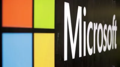 FILE - The Microsoft company logo is displayed at their offices in Sydney, Australia, on Wednesday, Feb. 3, 2021. Microsoft has closed on its approximately  billion acquisition of speech recognition company Nuance. The deal, which was announced last year, helps Microsoft Corp. get more entrenched into hospitals and the health care industry through Nuanceâ€™s widely used medical dictation and transcription tools. (AP Photo/Rick Rycroft, File)