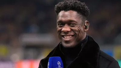 FILE - Former soccer players Clarence Seedorf smiles during an interview prior to the Champions League quarterfinal second leg soccer match between Inter Milan and Bayern Munich at the San Siro stadium in Milan, Italy, April 16, 2025. (AP Photo/Luca Bruno, File)