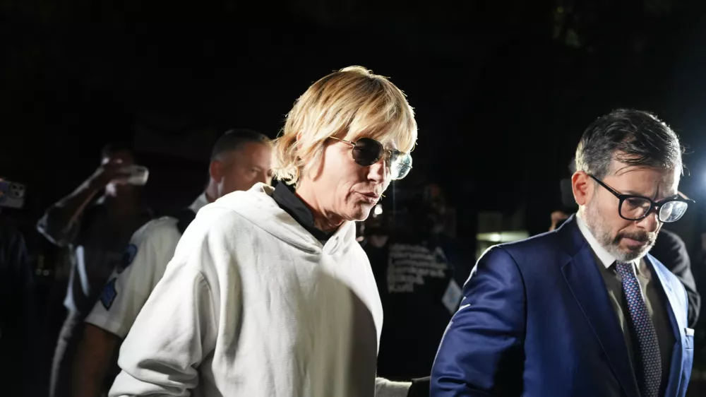 Selma Blair leaves court on Monday, Oct. 12, 2026, in New York after her arraignment on charges of injuring two flight attendants during a cross-country flight. (AP Photo/Ryan Murphy)