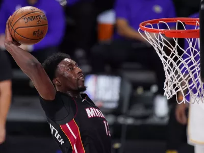 FILE - In this Oct. 11, 2020, file photo, Miami Heat's Bam Adebayo (13) dunks during the second half in Game 6 of basketball's NBA Finals against the Los Angeles Lakers in Lake Buena Vista, Fla. Adebayo and the Miami Heat are working on a contract extension, the team said Tuesday, Nov. 24, 2020, a deal that when finalized will likely guarantee him at least 8 million over the next six seasons and perhaps as much as 0 million in that span.(AP Photo/Mark J. Terrill, File)