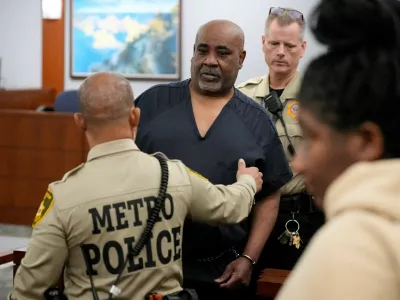 Duane Davis is escorted by police from a sentencing hearing after his murder conviction in the death of rapper Tupac Shakur on Tuesday, Oct. 13, 2026, in Las Vegas, Nevada, US.   John Locher/Pool via REUTERS
