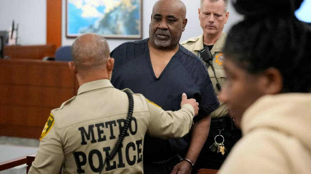 Duane Davis is escorted by police from a sentencing hearing after his murder conviction in the death of rapper Tupac Shakur on Tuesday, Oct. 13, 2026, in Las Vegas, Nevada, US.   John Locher/Pool via REUTERS