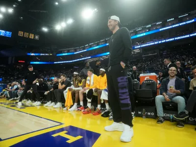 Los Angeles Lakers guard Luka Doncic stands in front of the bench during the first half of an NBA preseason basketball game against the Golden State Warriors, Tuesday, Oct. 6, 2026, in San Francisco. (AP Photo/Jeff Chiu)
