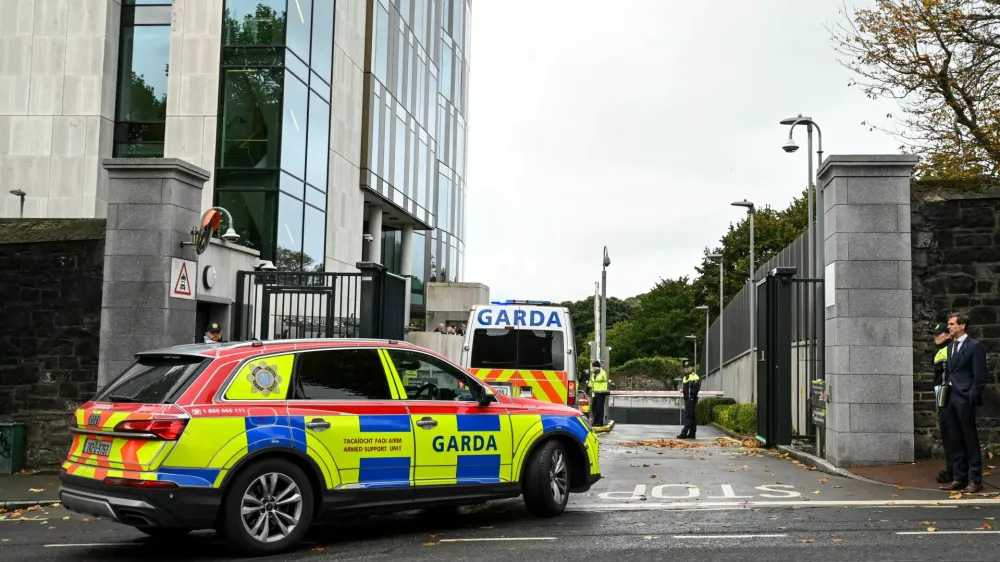 Garda vehicles arrive at the Special Criminal Court, where alleged Irish crime gang boss Daniel Kinahan is due to appear on charges of directing a criminal organisation, in Dublin, Ireland, October 12, 2026. REUTERS/Natalia Campos