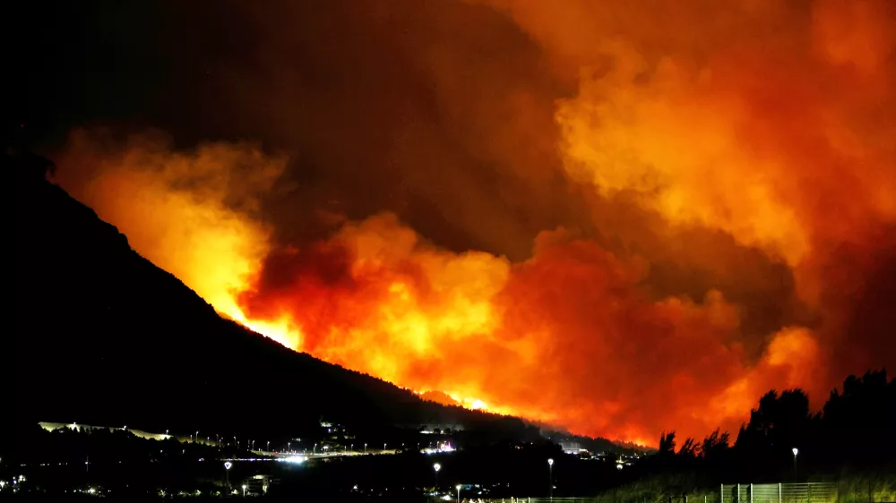 A general view of a wildfire near Omis, southern Croatia early Friday, August. 14, 2026. (AP Photo/Jakov Prkic)