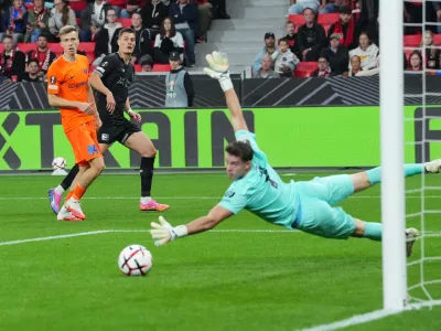 Leverkusen's Patrik Schick, center, fails to score during the Europa League opening phase soccer match between Bayer Leverkusen and NK Celje in Leverkusen, Germany, Wednesday, Sept. 16, 2026. (AP Photo/Martin Meissner)