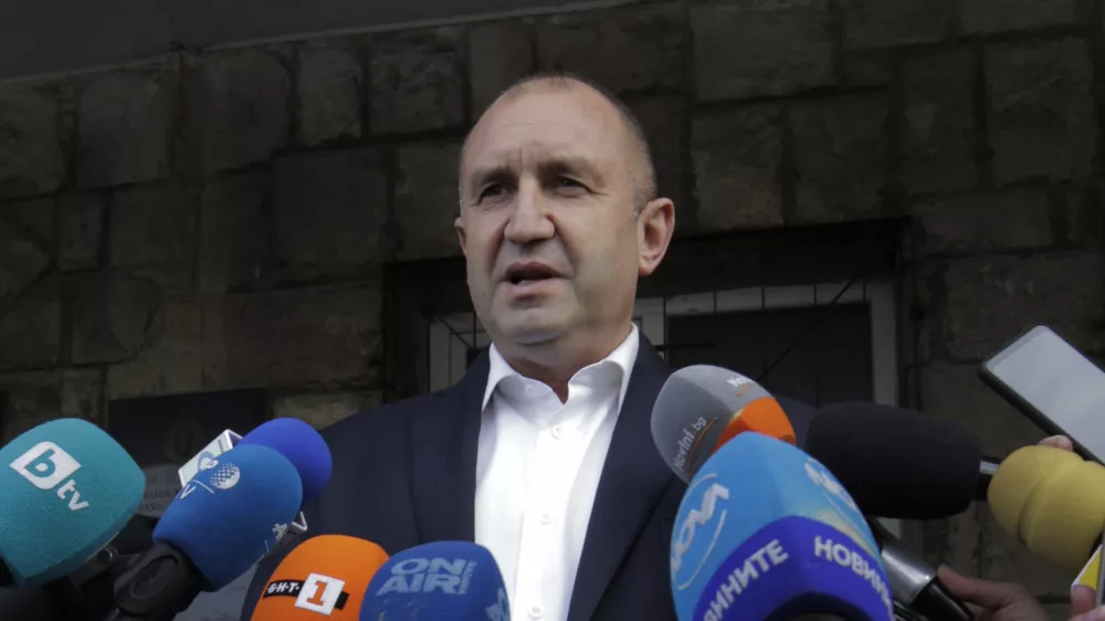 Bulgarian President Rumen Radev speaks to journalists after casting his vote in Sofia, Sunday, Nov. 21, 2021. Bulgarians are at the polls to choose a new president in a hotly contested runoff amid a COVID-19 surge and a political crisis that has gripped the European Union&acirc;&euro;&trade;s poorest country. The choice is between incumbent Rumen Radev and Sofia University rector Anastas Gerdzhikov. (AP Photo/Valentina Petrova)
