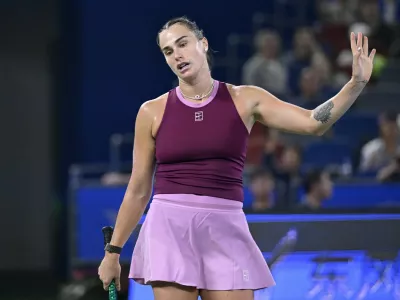 Belarus's Aryna Sabalenka reacts after a point against USA's Ann Li during their women's singles match at the Wuhan Open tennis tournament in Wuhan, in China's Hubei province on October 14, 2026.,Image: 1143276549, License: Rights-managed, Restrictions:, Model Release: no 