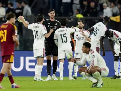Soccer Football - UEFA Champions League - AS Roma v Real Madrid - Stadio Olimpico, Rome, Italy - October 14, 2026 Real Madrid's Thibaut Courtois celebrates with teammates after the match REUTERS/Matteo Ciambelli