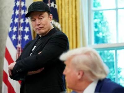 FILE PHOTO: U.S. President Donald Trump and Elon Musk attend a press conference in the Oval Office of the White House in Washington, D.C., U.S., May 30, 2025. REUTERS/Nathan Howard/File Photo