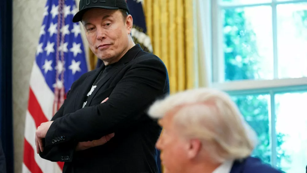 FILE PHOTO: U.S. President Donald Trump and Elon Musk attend a press conference in the Oval Office of the White House in Washington, D.C., U.S., May 30, 2025. REUTERS/Nathan Howard/File Photo