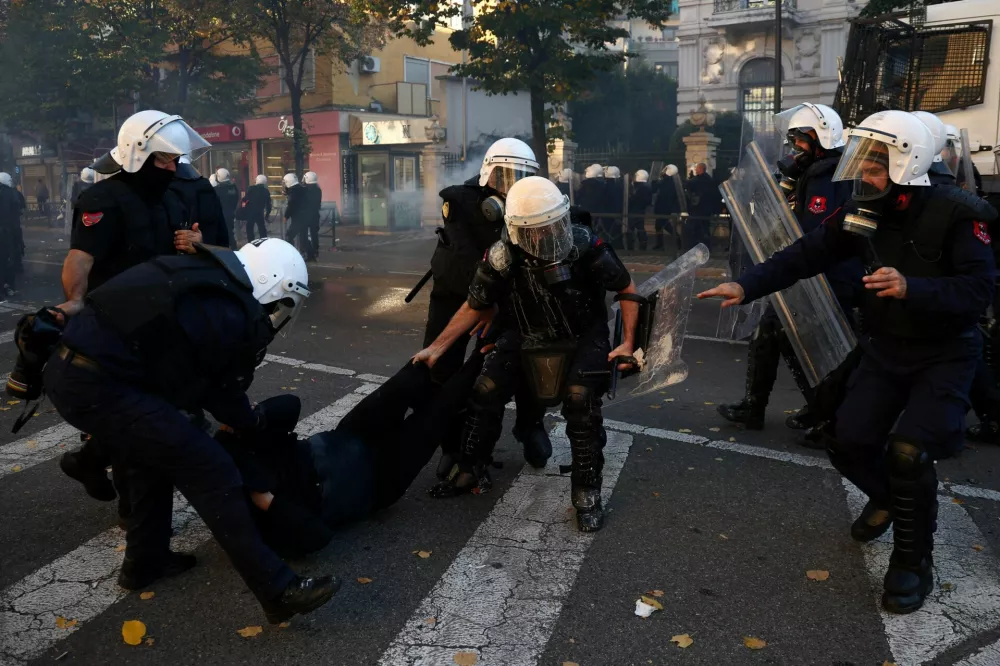 Police detain a protester as Albanian students hold an anti-government protest in Tirana, Albania, October 13, 2026. REUTERS/Florion Goga