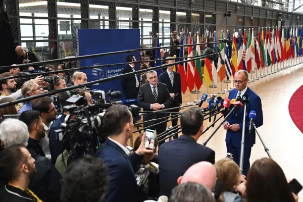 Germany's Chancellor Friedrich Merz speaks with the media as he arrives for the EU summit at the European Council building in Brussels, Thursday, Oct. 15, 2026. (AP Photo/Harry Nakos)