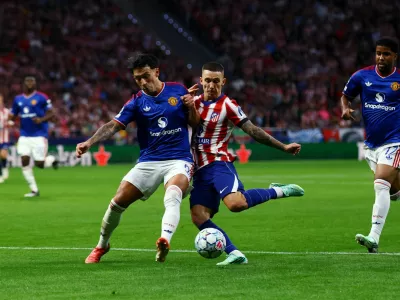 FILE PHOTO: Soccer Football - UEFA Champions League - Atletico Madrid v Manchester United - Riyadh Air Metropolitano, Madrid, Spain - October 13, 2026 Manchester United's Lisandro Martinez in action with Atletico Madrid's Alejandro Grimaldo REUTERS/Susana Vera/File Photo