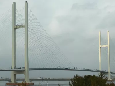 Trucks cross the newly opened New Yalu River Bridge, which connects China's Dandong New Zone and North Korea's Sinuiju, as seen from Dandong, Liaoning Province, China, October 15, 2026. REUTERS/Florence Lo