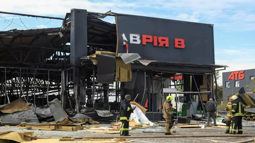 Firefighters work at a site of the supermarket damaged by a Russian jet drone strike, amid Russia's attack on Ukraine, in Odesa region, Ukraine October 15, 2026. REUTERS/Nina Liashonok