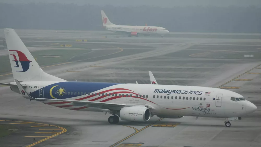 Malaysia Airlines and Lion Air aircraft on the haze-shrouded tarmac at Kuala Lumpur International Airport in Sepang, Malaysia, October 14, 2026. REUTERS/Hasnoor Hussain