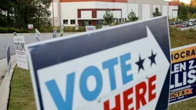 Early midterm voting is advertised at a polling place in the Fulton County Election Hub and Operation Center, the site searched by the FBI and then-Director of National Intelligence Tulsi Gabbard in January, in Union City, Georgia, US, October 13, 2026. REUTERS/Jonathan Ernst 