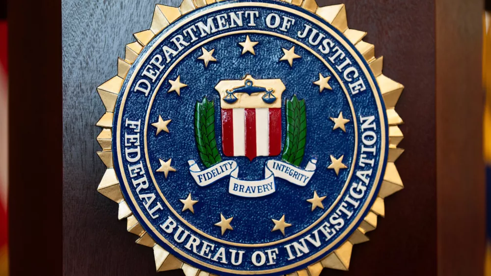 FILE - An FBI seal is displayed on a podium before a news conference at the field office in Portland, Ore., Jan. 16, 2025. (AP Photo/Jenny Kane, File)