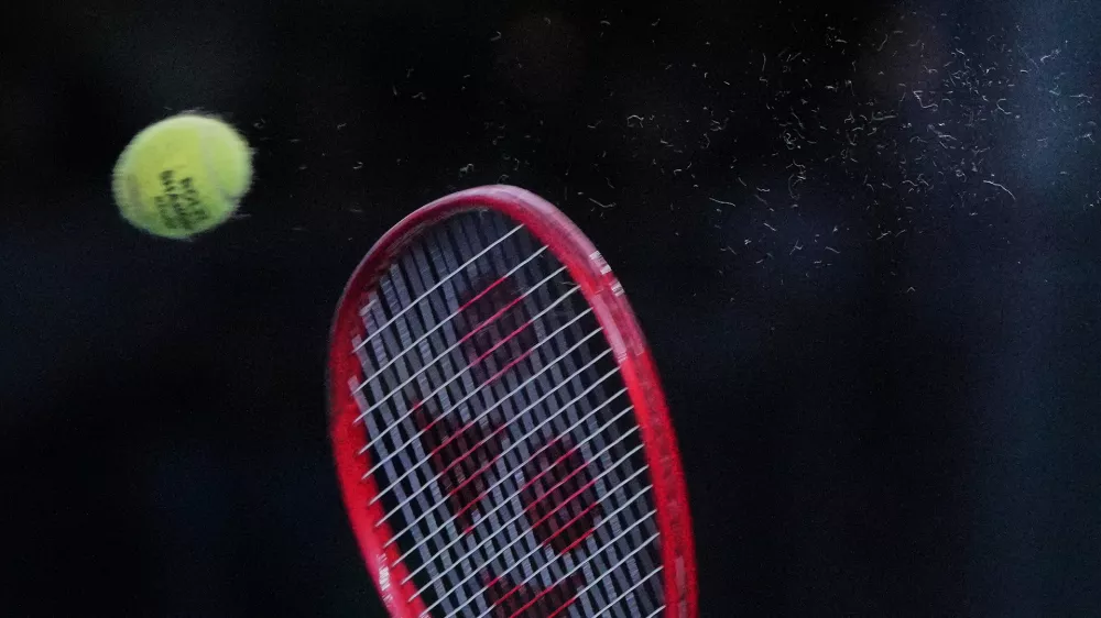 Tommy Paul, of the United States, serves to Zizou Bergs, of Belgium, during the fourth round of the men's singles match at the Shanghai Masters tennis tournament in Shanghai, China, Wednesday, Oct. 14, 2026. (AP Photo/Andy Wong)