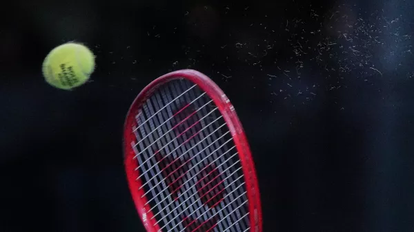 Tommy Paul, of the United States, serves to Zizou Bergs, of Belgium, during the fourth round of the men's singles match at the Shanghai Masters tennis tournament in Shanghai, China, Wednesday, Oct. 14, 2026. (AP Photo/Andy Wong)