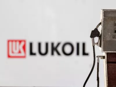 Model of petrol pump is seen in front of LUKOIL logo in this illustration taken March 25, 2022. REUTERS/Dado Ruvic/Illustration