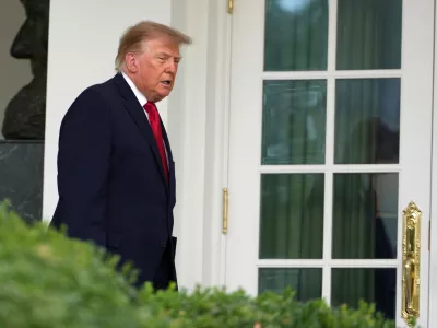 President Donald Trump walks to the Rose Garden of the White House to attend an event for first responders, Thursday, Oct. 15, 2026, in Washington. (AP Photo/Julia Demaree Nikhinson)
