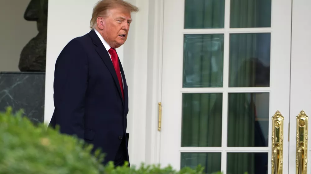 President Donald Trump walks to the Rose Garden of the White House to attend an event for first responders, Thursday, Oct. 15, 2026, in Washington. (AP Photo/Julia Demaree Nikhinson)