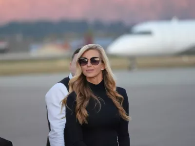 White House press secretary Katie Zacharia arrives with President Donald Trump at Glacier Park International Airport, Wednesday, Oct. 14, 2026, in Kalispell, Mont. (AP Photo/Alex Brandon)