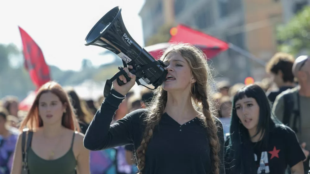 A demonstrator shouts slogans through a megaphone during a student protest against the Italian government's education policies in Rome, Italy, October 16, 2026. REUTERS/Francesco Fotia