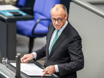 German Chancellor Friedrich Merz speaks during a meeting of the German federal parliament, Bundestag, at the Reichstag building in Berlin, Germany, Wednesday, Oct. 14, 2026. (Michael Kappeler/dpa via AP)