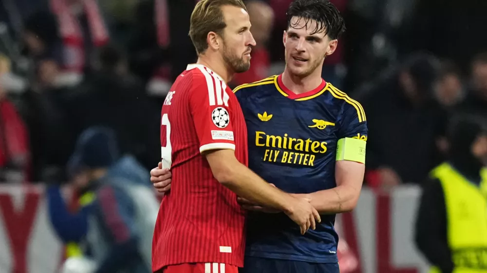Bayern's Harry Kane, left, and Arsenal's Declan Rice talk after the UEFA Champions League soccer match between Bayern and Arsenal in Munich Germany, Wednesday, Oct. 21, 2026. (AP Photo/Martin Meissner)