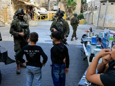 Israeli forces keep watch on the day of Israeli settlers' weekly tour in Hebron, in the Israeli-occupied West Bank, October 17, 2026. REUTERS/Mussa Qawasma