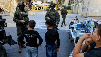 Israeli forces keep watch on the day of Israeli settlers' weekly tour in Hebron, in the Israeli-occupied West Bank, October 17, 2026. REUTERS/Mussa Qawasma