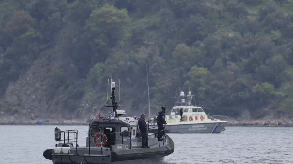 FILE- Frontex, foreground, and Greek coast guard vessels take part in a search and rescue operation, after the capsizing of a boat carrying migrants, off the coast on the northeastern Aegean Sea island of Lesbos, Greece, on April 3, 2025. (AP Photo/Panagiotis Balaskas, File)