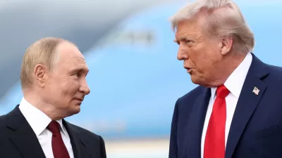 FILE PHOTO: US President Donald Trump speaks with Russian President Vladimir Putin, as they meet to negotiate for an end to the war in Ukraine, at Joint Base Elmendorf-Richardson in Anchorage, Alaska, US, August 15, 2025. REUTERS/Kevin Lamarque/File Photo