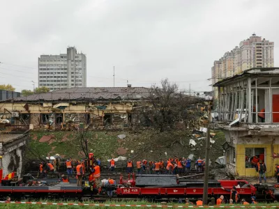 Employees repair railway tracks and remove debris at a metro station which was hit by an overnight Russian missile strike, amid Russia's attack on Ukraine, in Kyiv, Ukraine October 19, 2026. REUTERS/Valentyn Ogirenko