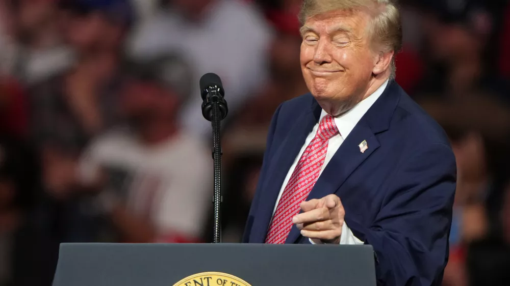 President Donald Trump speaks at a campaign rally at Heartland Credit Union Arena, Monday, Oct. 19, 2026, in Park City, Kan. (AP Photo/Charlie Riedel)