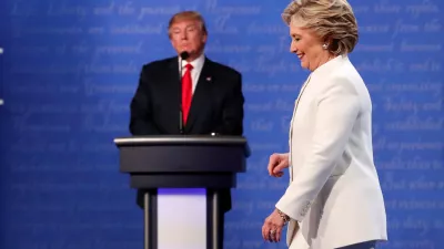 FILE PHOTO: Democratic U.S. presidential nominee Hillary Clinton walks off the debate stage as Republican U.S. presidential nominee Donald Trump remains at his podium after the conclusion of their third and final 2016 presidential campaign debate at UNLV in Las Vegas, Nevada, U.S., October 19, 2016. REUTERS/Rick Wilking/File Photo