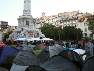 People at a protest camp Rossio square against house crisis and cost of living, in Lisbon, Portugal, October 19, 2026. REUTERS/Pedro Nunes