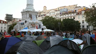 People at a protest camp Rossio square against house crisis and cost of living, in Lisbon, Portugal, October 19, 2026. REUTERS/Pedro Nunes