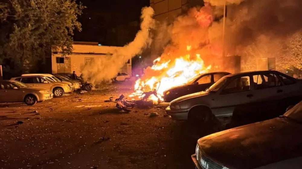Cars burn after they were damaged by a Russian drone strike in a residential area, amid Russia's attack on Ukraine, in Kyiv, Ukraine October 21, 2026. Press service of the State Emergency Service of Ukraine in Kyiv city/Handout via REUTERS ATTENTION EDITORS - THIS IMAGE HAS BEEN SUPPLIED BY A THIRD PARTY. DO NOT OBSCURE LOGO.
