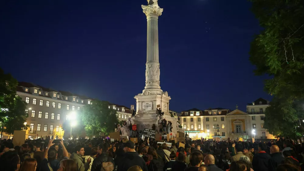 People gather to protest in Rossio Square against the housing crisis and cost of living, in Lisbon, Portugal, October 20, 2026. REUTERS/Pedro Nunes