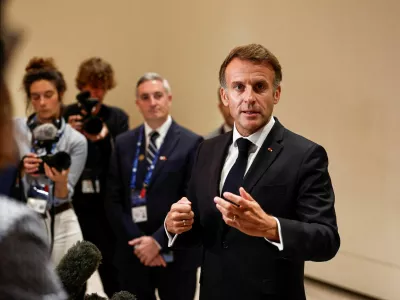French President Emmanuel Macron speaks to members of the media on the day of the 9th Annual One Planet Sovereign Wealth Funds (OPSWF) Summit, in Lusail, Qatar, October 21, 2026. REUTERS/Benoit Tessier/Pool