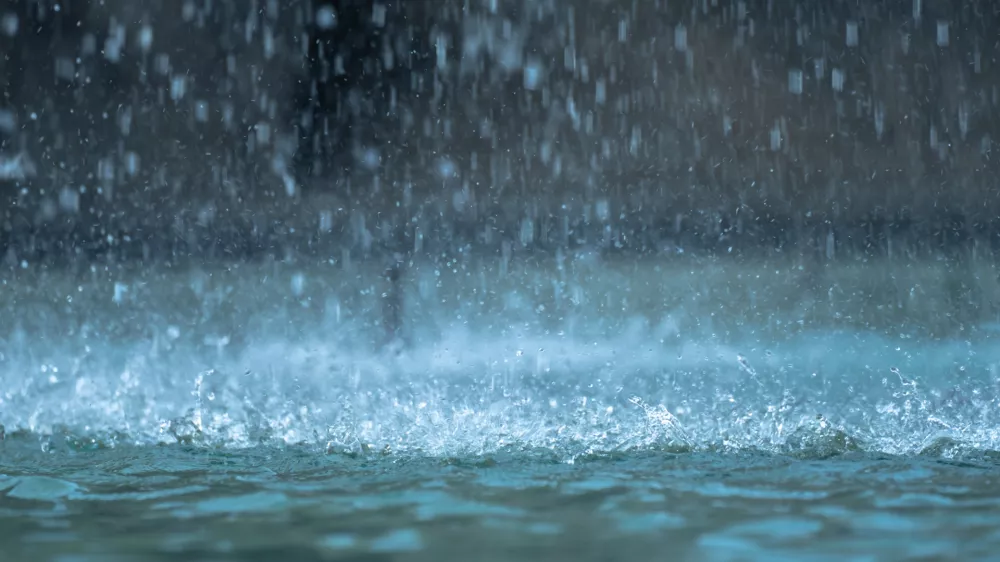 Heavy raindrops splashing on the ground