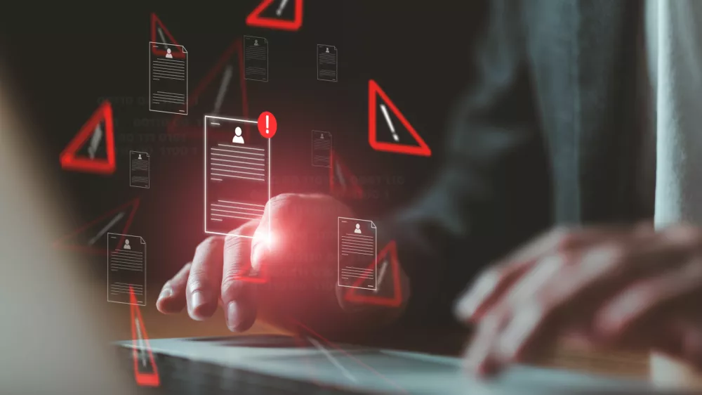 Close up shot of people point to access to personal data and document with warning sign as concept of data breach or attack from hacker or spyware. Data security concept.