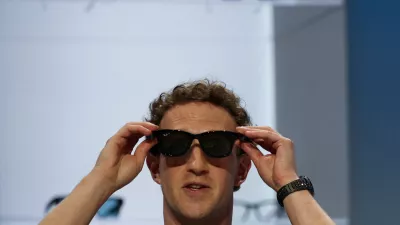 FILE PHOTO: Meta CEO Mark Zuckerberg tries on Meta smart glasses during the Meta Connect event at the company's headquarters in Menlo Park, California, U.S., September 23, 2026. REUTERS/Carlos Barria/File Photo
