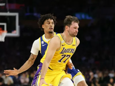 LOS ANGELES, CALIFORNIA - OCTOBER 21: Luka Doncic #77 of the Los Angeles Lakers dribbles past the defense of Yaxel Lendeborg #1 of the Golden State Warriors during the first half of a game at Crypto.com Arena on October 21, 2026 in Los Angeles, California.,Image: 1145561999, License: Rights-managed, Restrictions: NOTE TO USER: User expressly acknowledges and agrees that, by downloading and or using this photograph, User is consenting to the terms and conditions of the Getty Images License Agreement., Model Release: no 